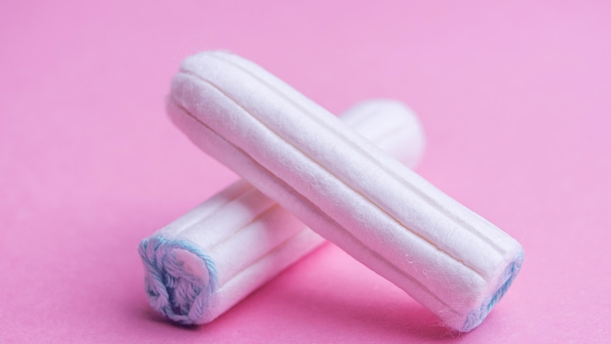 Two Tampons on pink background