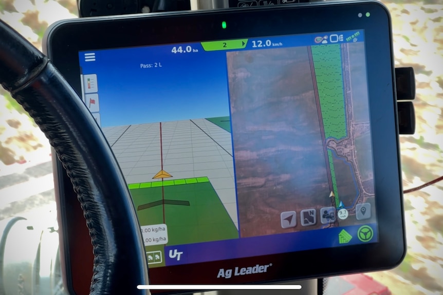 A computer screen shows which parts of the farm paddock have been sown