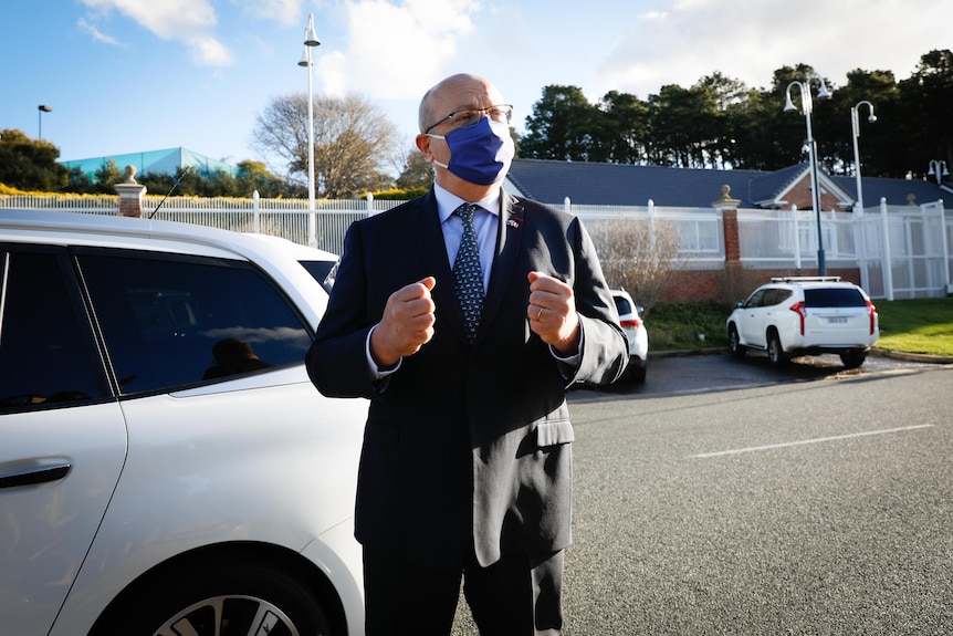 French Ambassador Jean-Pierre Thebault gestures outside his Canberra residence.