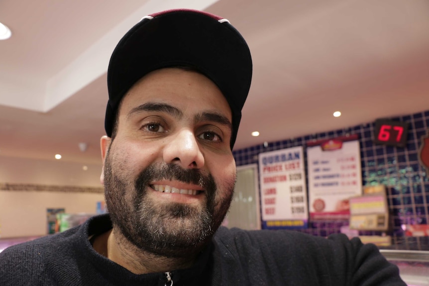 Manager of Madina Halal Meats, Houssam Dannaoui stands in his shop.