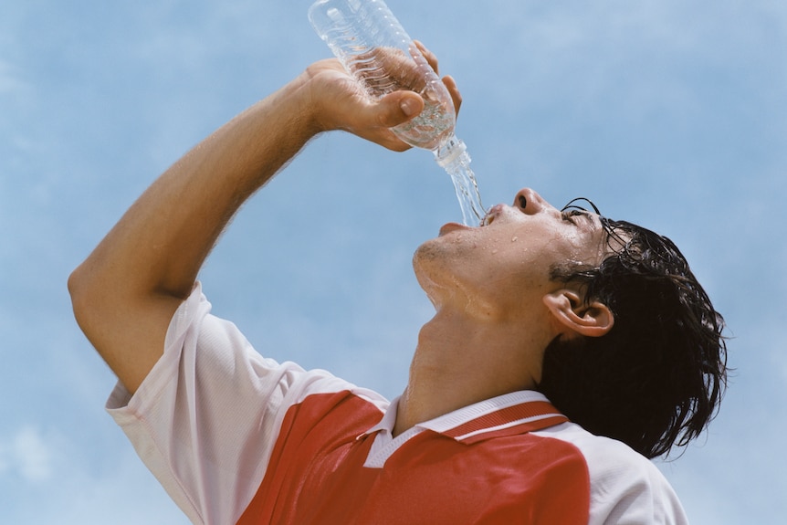 Athlete drinking water