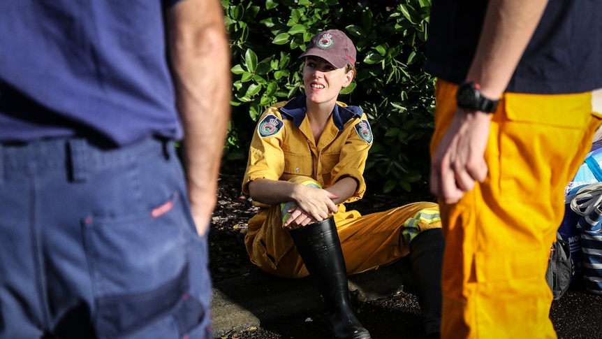 Rural Fire Service volunteer sitting on ground