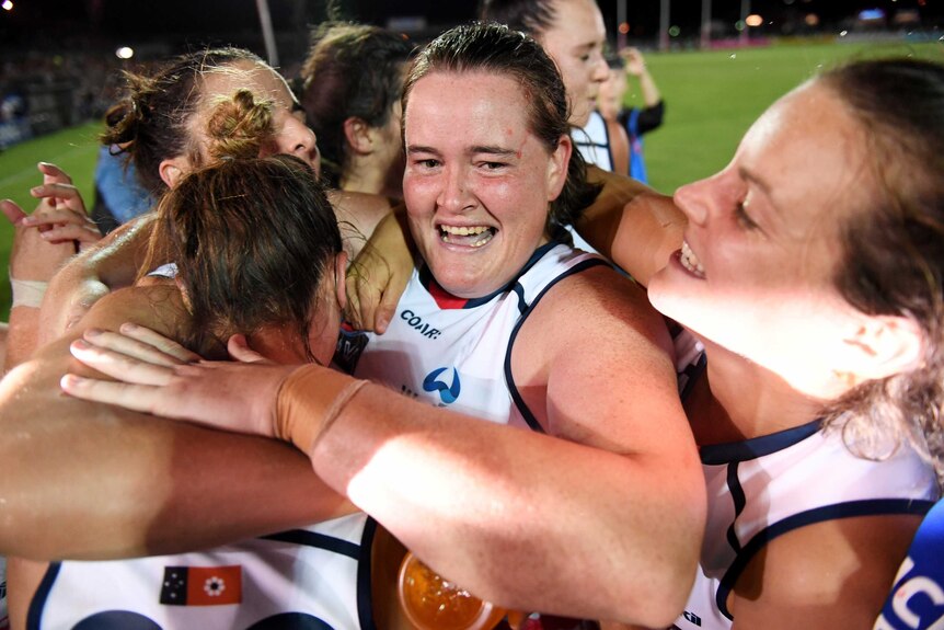 Sarah Perkins of the Crows celebrates her team's win.