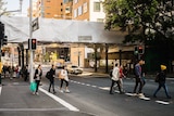 The Ultimo Road rail bridge under white plastic wrap