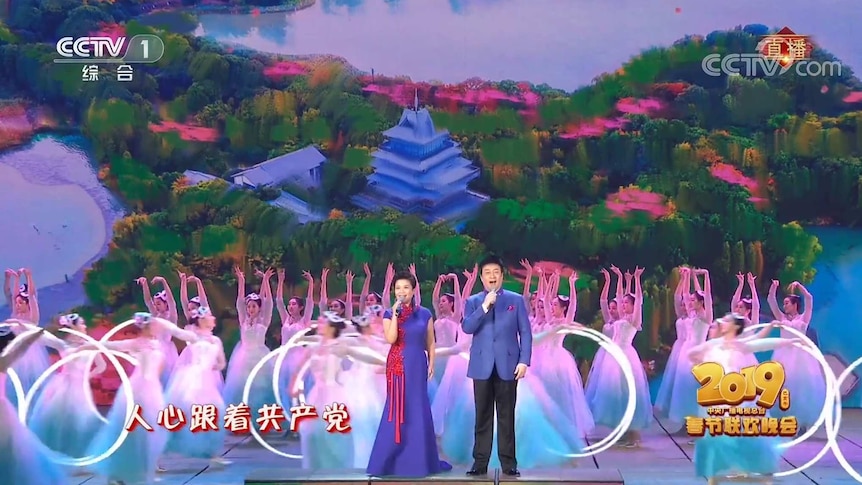 Well-known Chinese singers Ye Zhang and Jihong Lv, right, sing "People's hearts are following the Communist Party".