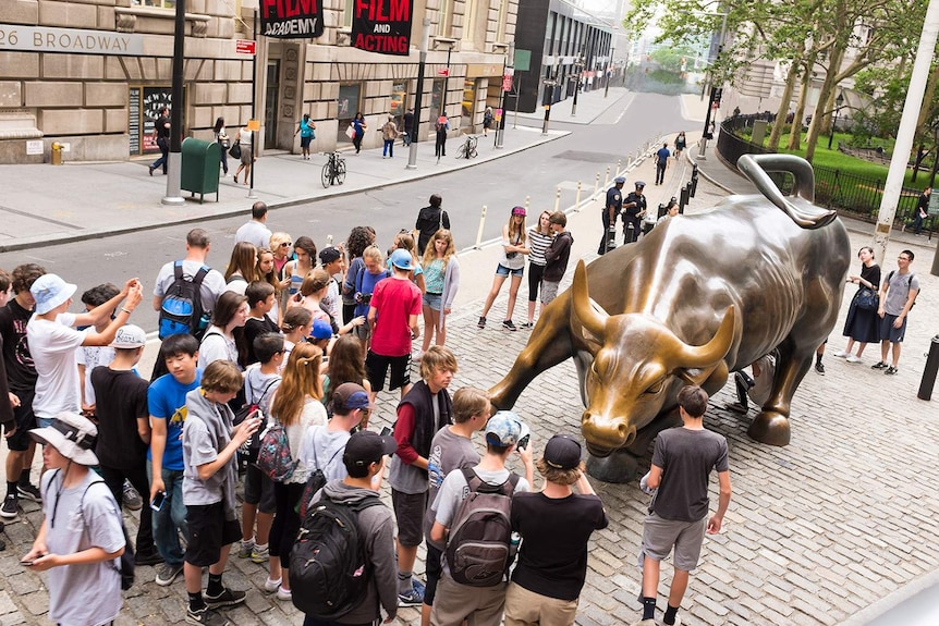 A visualisation of what the iconic bull statue in New York would look like after two degrees of warming, with water visible in the distance downtown.