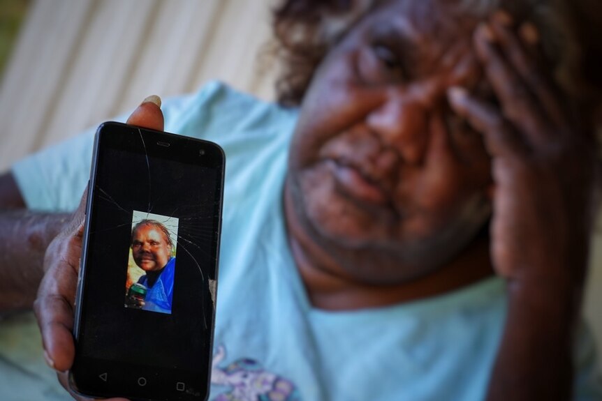 Louise Rankine holds a photo of her daughter Sasha Green, who was found dead in Tennant Creek in 2013.