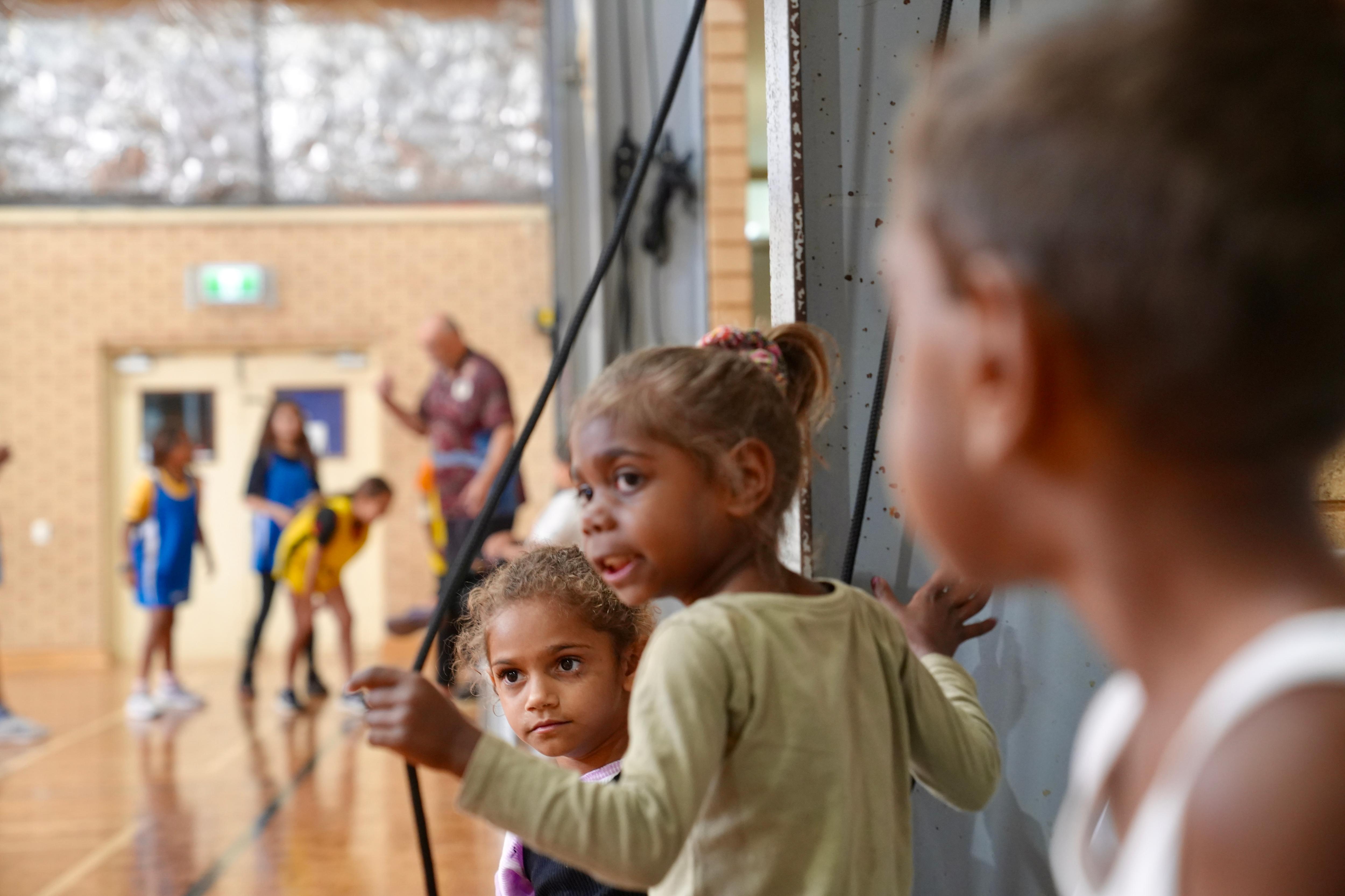 Aboriginal children watching basketball