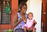 A woman with her baby in Binjari