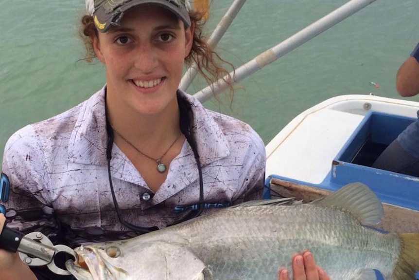 Fisherwoman Prue Davey holds a fish.