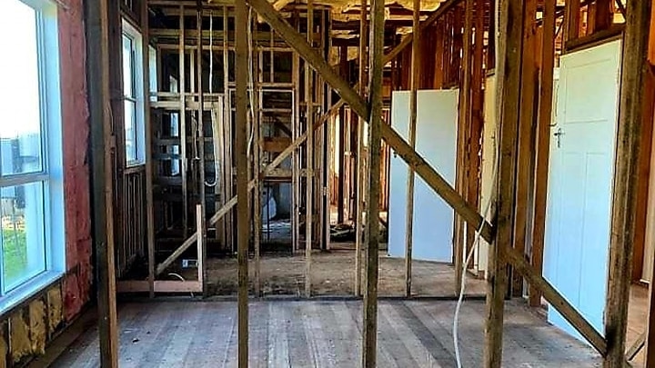 A house being renovated with just timber frames showing