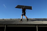 Solar panels being installed on a rooftop in Sydney