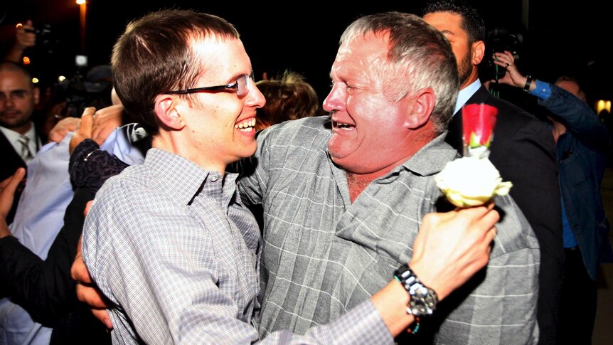 American hiker Shane Bauer is greeted by a relative in Oman, after he and Josh Fattal were released