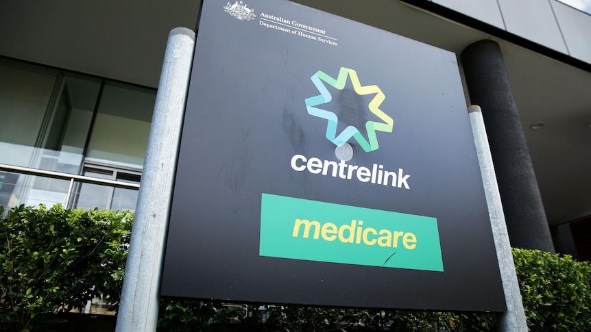 A Centrelink/Medicare sign outside a branch.