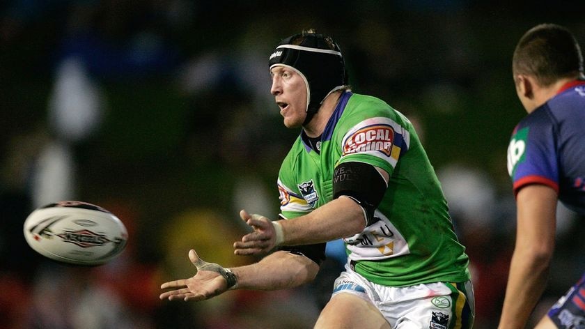 Raiders skipper Alan Tongue off-loads the football against the Knights
