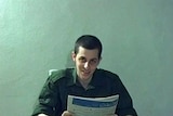 Gilad Shalit smiles briefly.