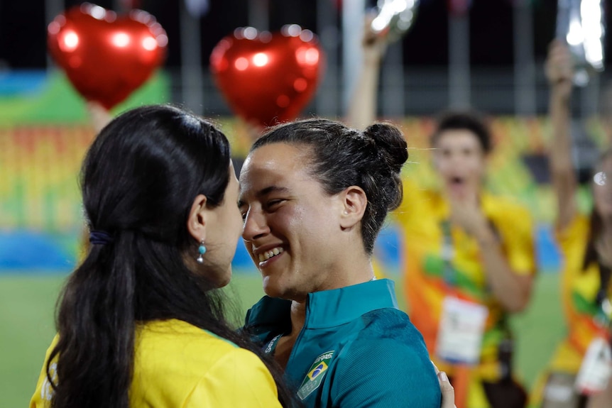 Brazil's Isadora Cerullo and partner Marjorie Enya embrace after getting engaged