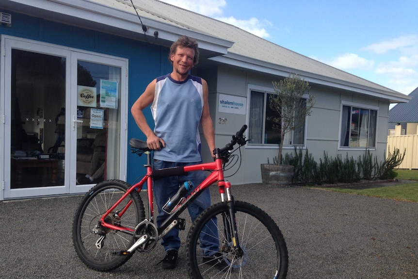 Shane - homeless but with transport outside Shalom House in Albany