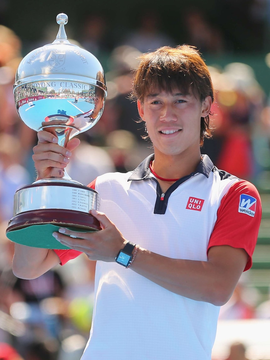 Nishikori celebrates with Kooyong Classic trophy