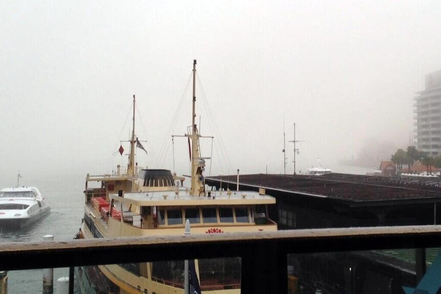 Fog shrouds Circular Quay in Sydney.
