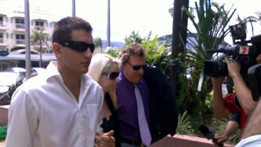 Sergie Brennan (left) and his partner, Tegan Leach (centre), arrive at Cairns District Court.