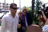 Sergie Brennan (left) and his partner, Tegan Leach (centre), arrive at Cairns District Court.