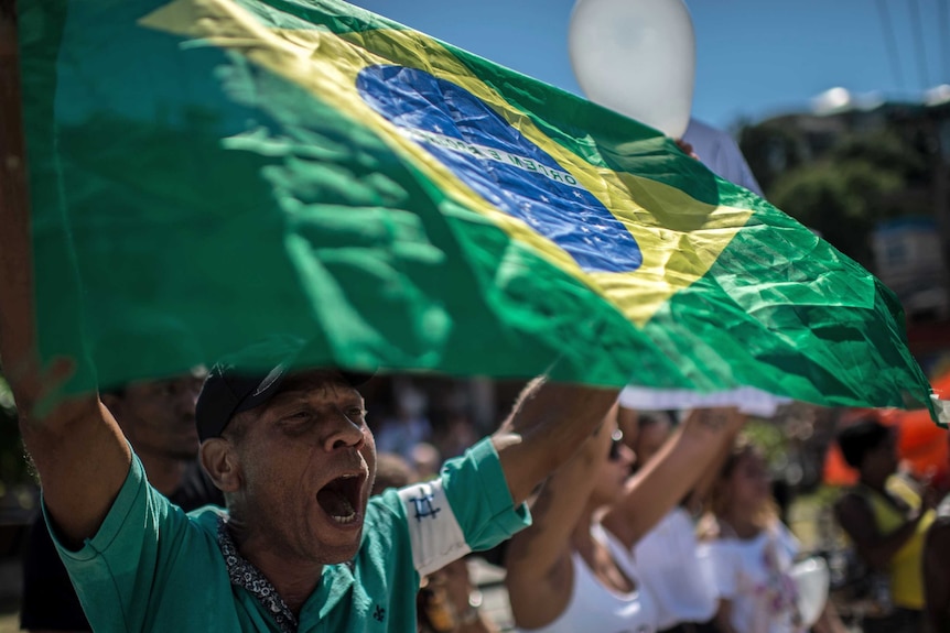 People participate in a "march for peace" in Rio de Janeiro