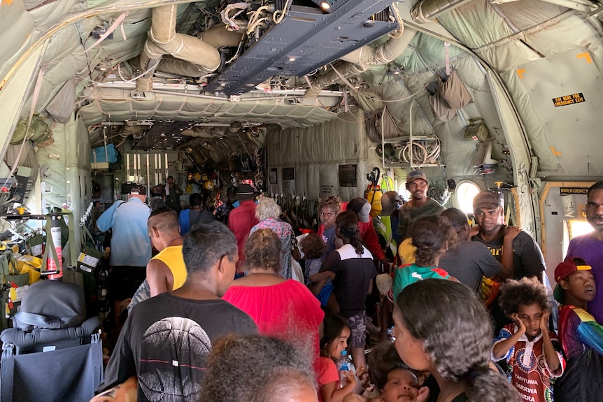 Hundreds of residents packed into an army plane.