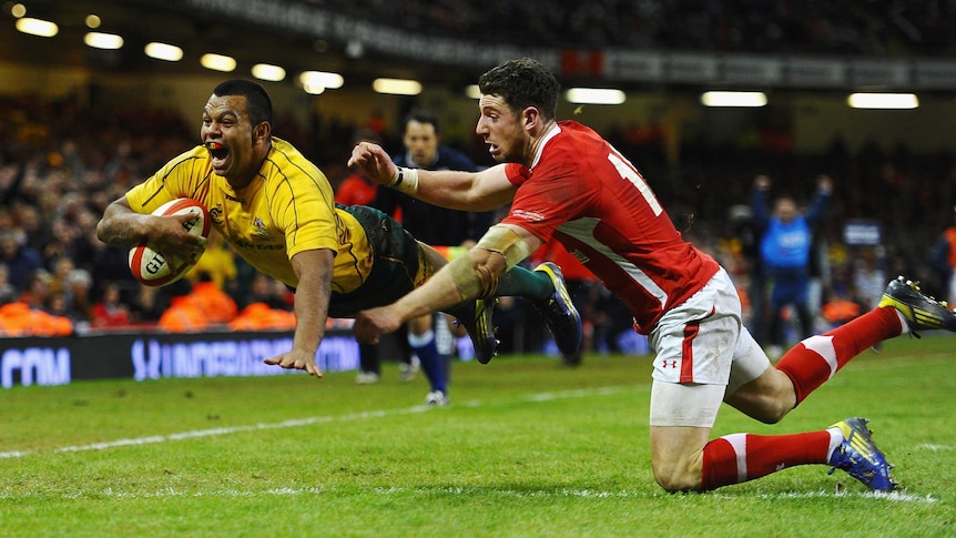 Joy and relief ... Kurtley Beale scores in the corner to sink Wales at the death.