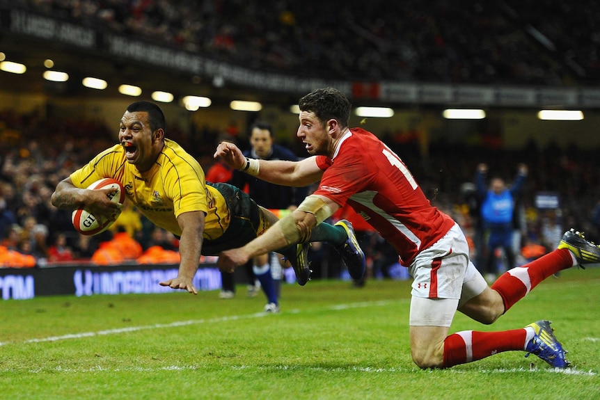 Joy and relief ... Kurtley Beale scores in the corner to sink Wales at the death.