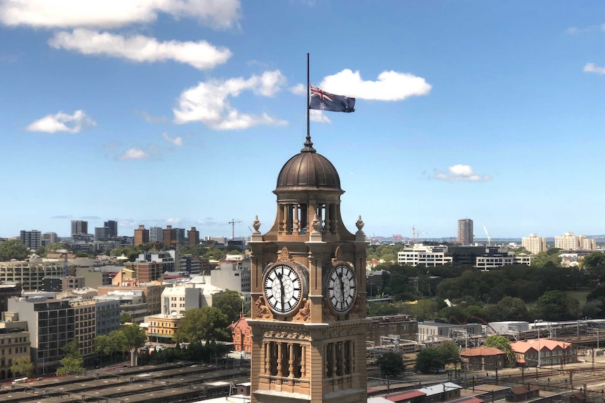 The flag on Sydney's clock tower (Central Station) flies at half-mast.