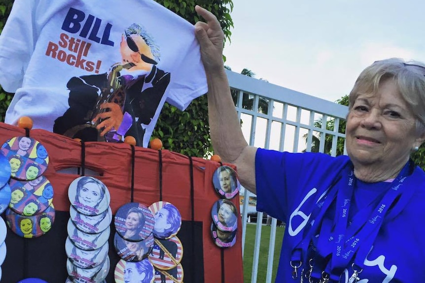 Hillary fan Anna Jacobson holds up her favourite merchandise item