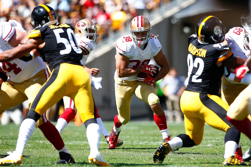 San Francisco 49ers' Jarryd Hayne runs the ball against the Pittsburgh Steelers in September 2015.