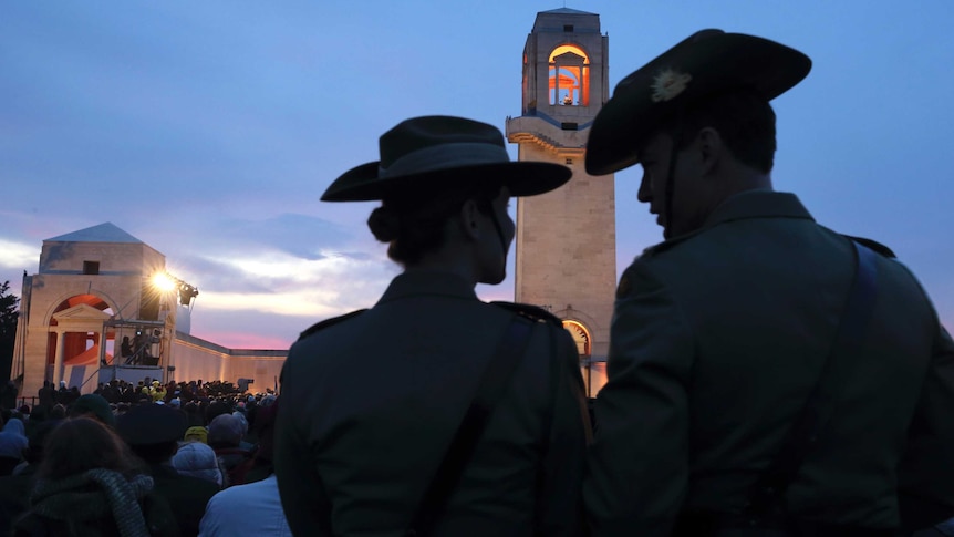 Two Australian soldiers attend the dawn service at the Australian National Memorial in Villers-Bretonneux.