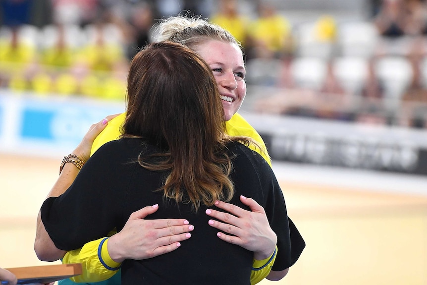 Stephanie Morton hugs former cyclist Anna Meares after winning gold in the Women's Sprint Finals.