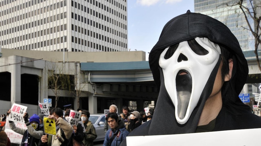 A protester wearing a scream mask at a rally in Tokyo against nuclear power on March 27, 2011.