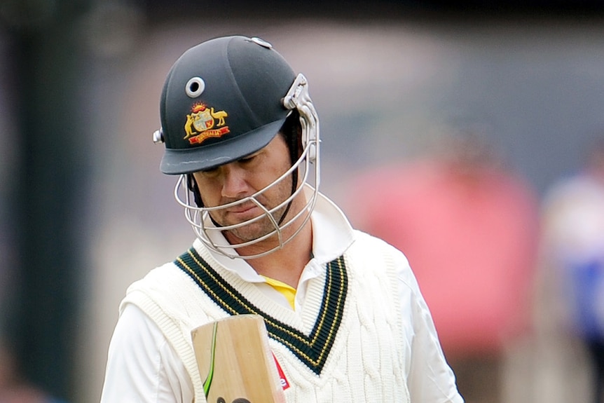 Ponting looks at the toe of his bat in Bellerive