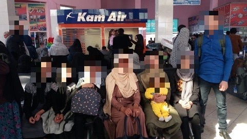 Afghan family at airport