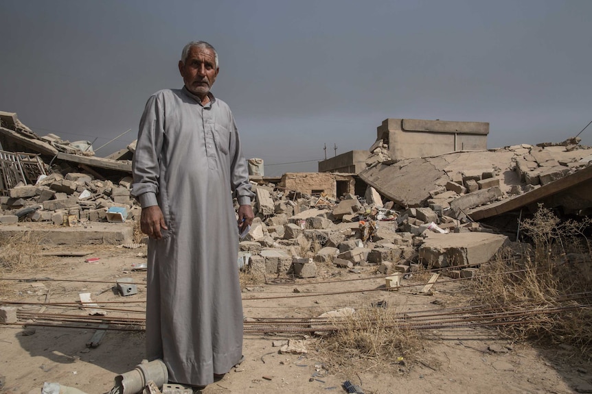 Man ruins of his brother's house in the village of Imam Gharb near Mosul