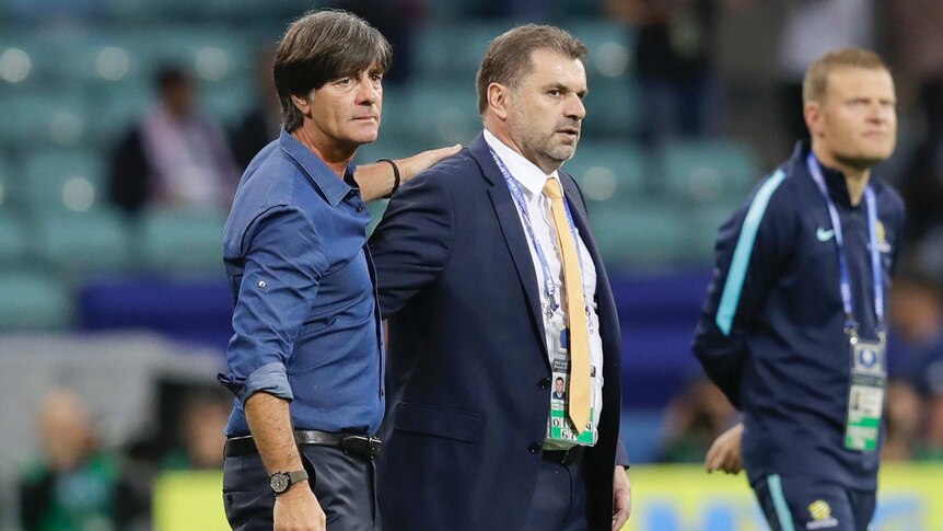 German coach Joachim Loew greets Australia's Ange Postecoglou after the Confederations Cup match