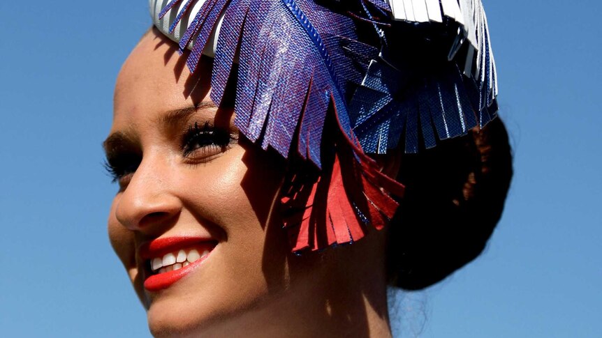 A contestant smiles during Fashions on the Field at Flemington racecourse on Melbourne Cup day.