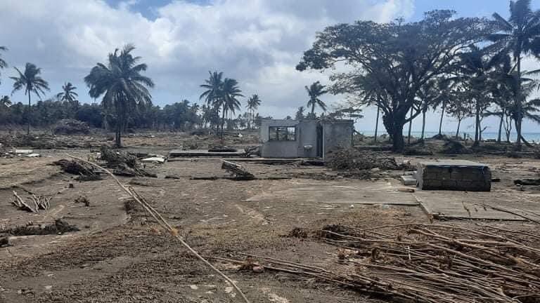 Volcanic ash coating tsunami affected ground.