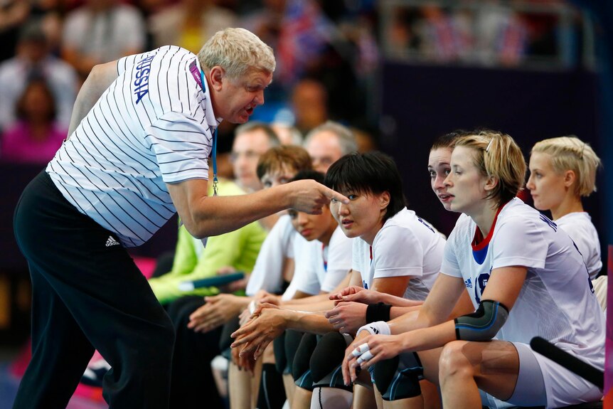 Evgeny Trefilov talks to his team at the London 2012 Olympic Games.