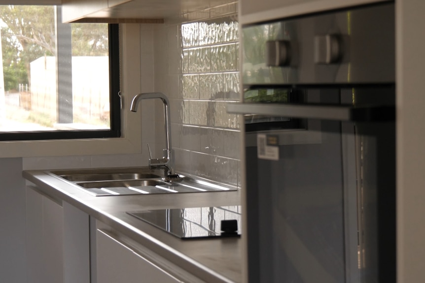 A brand new grey kitchen in the elder housing in Wilcannia. 