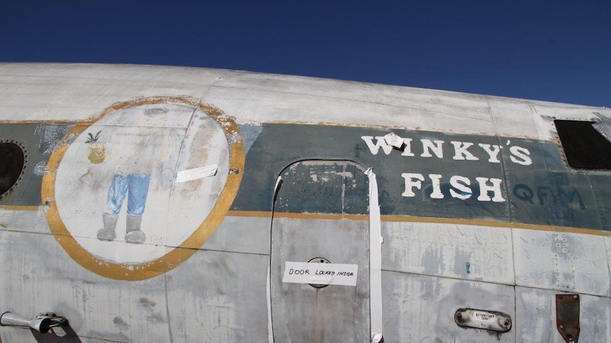Old signage on the side of the Lockheed Super Constellation at the Qantas Founders Museum