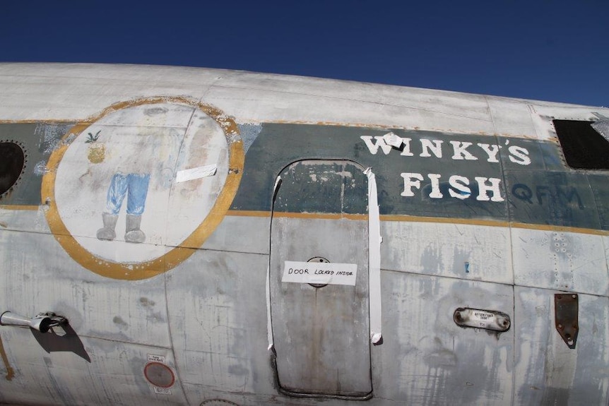 Old signage on the side of the Lockheed Super Constellation at the Qantas Founders Museum