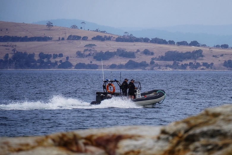 Tasmania Police search the coastline off Kingston Beach, near Hobart, after a shark sighting, 9 January, 2020.