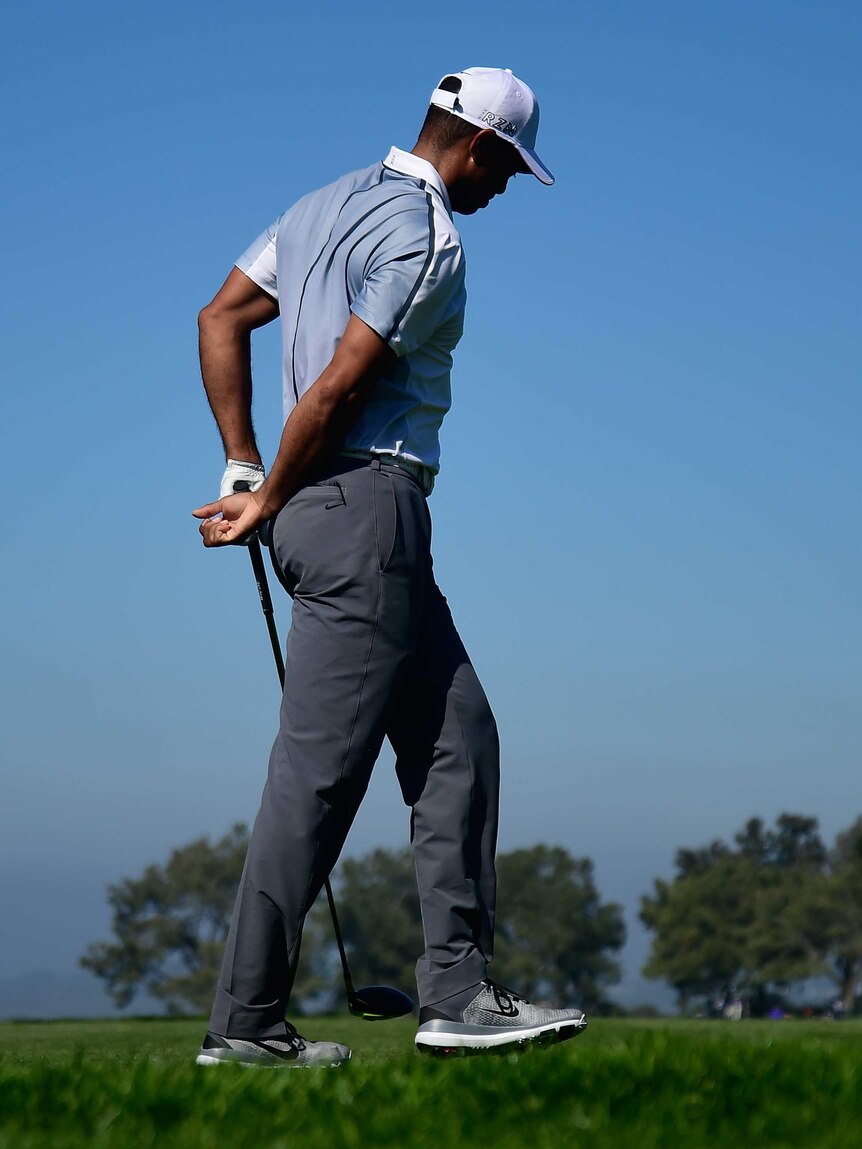 Tiger Woods holds his back during the PGA Tour event at Torrey Pines on February 5, 2015.