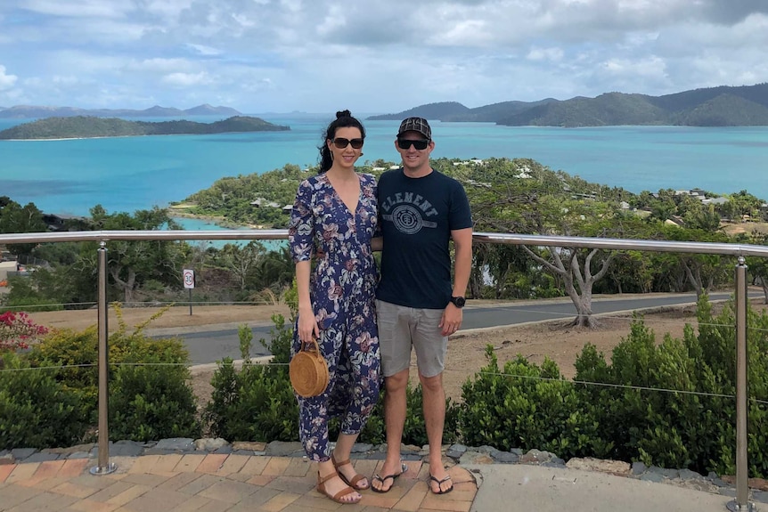 Christie and Adrian Parody with a view of the ocean in the background