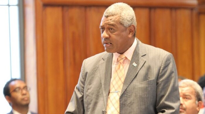 Fiji's Home Affairs Minister Pio Tikoduadua speaks at a lectern in parliament. 